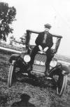 Man sitting on car