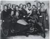 Women around motorcycle